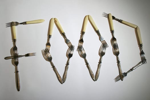 Word food made of old silver forks