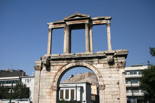 Hadrian's Arch in Athens, with the parthenon seen in the background.