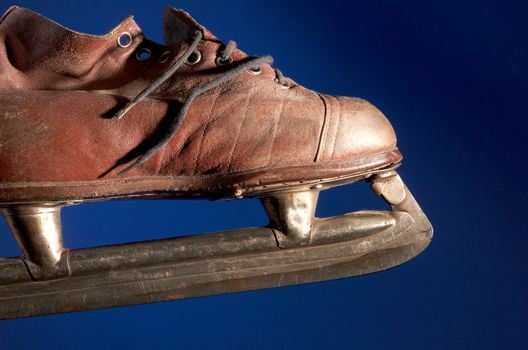 Old skate on a dark blue background