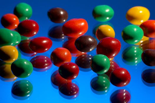 Multi-coloured sweets on a dark blue background