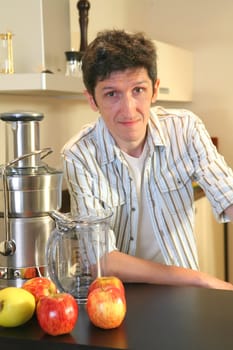 Smiling Man with squeezer, in striped shirt and apple