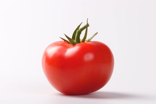 red tomato on the white background