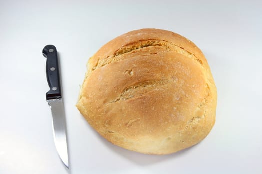 bread loaf and knife closeup food concepts