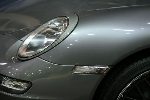 sports car front and wheel detail from exhibition horizontal