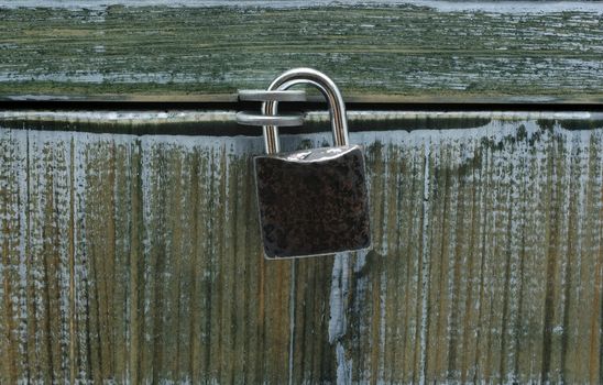 Locked wooden chest as background or backdrop.