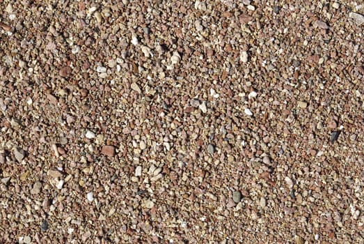 Red pebble on the coastline of Red Sea backdrop, Egypt, Africa.