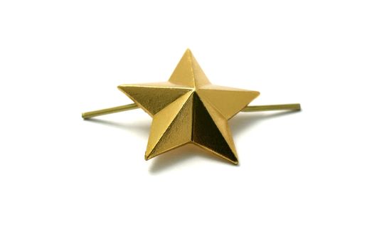 Golden star for shoulder marks isolated on white background.