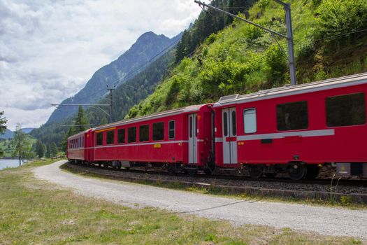Swiss mountain train Bernina Express from Tirano to St.Moritz