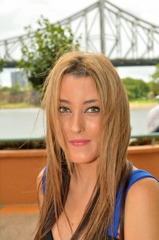 Pretty teenage girl with the Brisbane Story Bridge in the background.