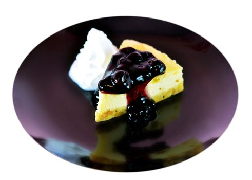 a slice of blueberry cheese cake served with whipped cream