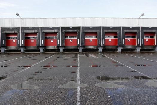 numbers 5 to 12 on red doors of loading docks