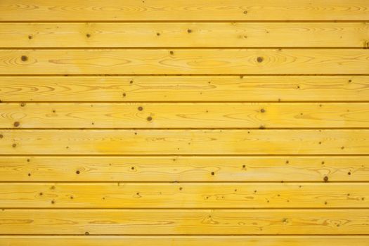 yellow wooden fence made of pine wood