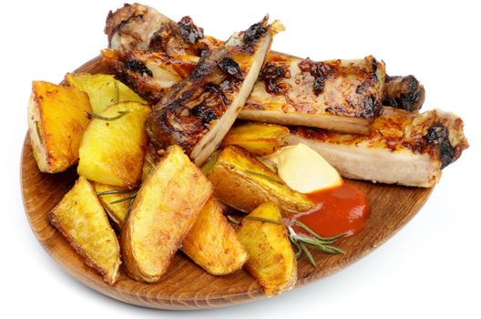 Wooden Dinner Plate with Barbecue Pork Ribs and Roasted Potato Wedges, Ketchup and Cheese Sauce closeup on white background