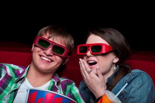 couple in a movie theater, watching a 3D movie