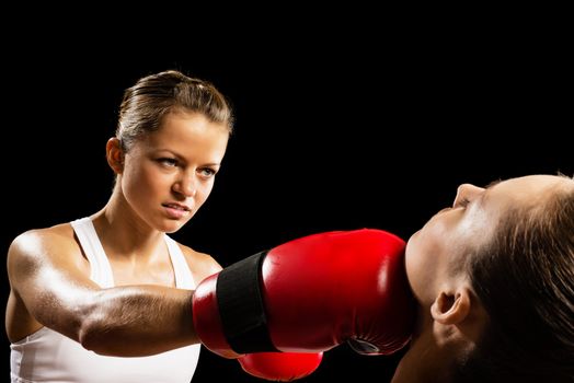 Aggressive boxing woman, hits an opponent in the head