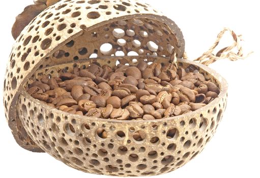 Coffee grains in a decorative pot isolated on a white background.