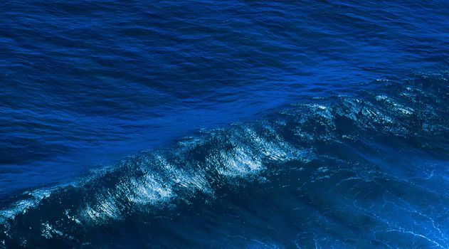 Big ocean wave close up isolated blue