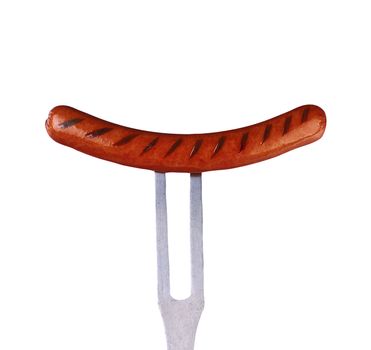close up of sausage and fork on white background