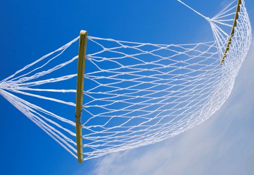 view of nice white hammock on blue sky background