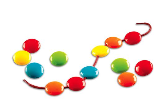 different color buttons on a shoestring on white