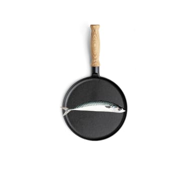 Cooking fish in frying pan isolated