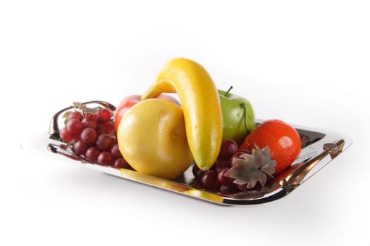 Selection of artificial fruit on plate
