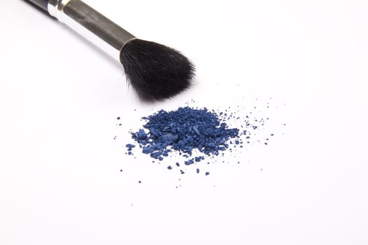 Cosmetic powder and black brush isolated