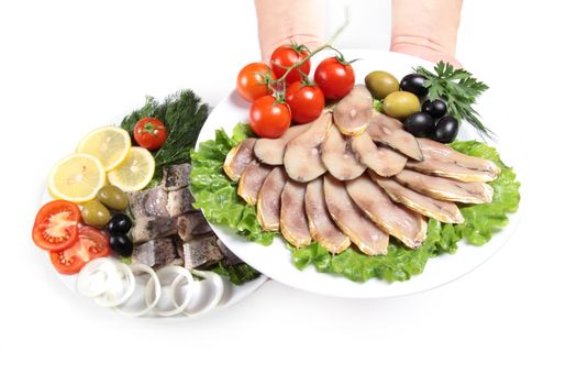 human hand with plate and slices fish