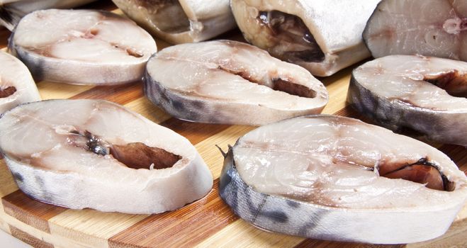nice slices fish and wooden plate