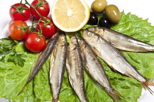 smoked fish served with tomato fennel and olive