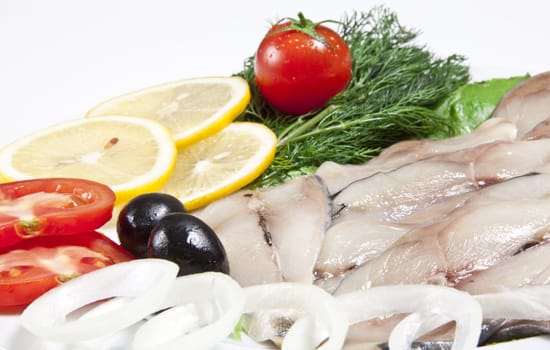 macro picture of fillet herring with vegetables