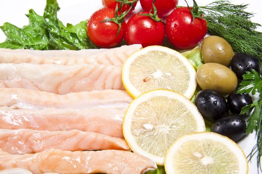 raw red fish with lemon and olive