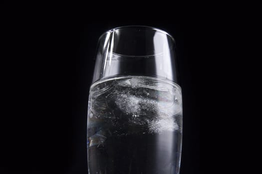 glass with ice cubes isolated