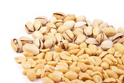 Fresh salty peanuts isolated on pure white