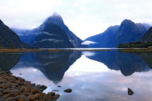 reflection of high mountain glacier at milford sound, New Zealand