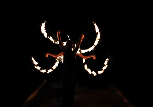 Image of dance with fire at night