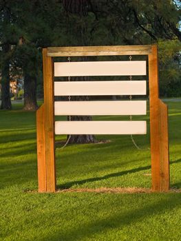 Blank Wooden Signs in a Sunlit Park