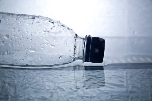 Bottle with pure water and splash