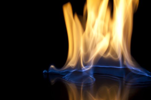 Fire flames over black background texture
