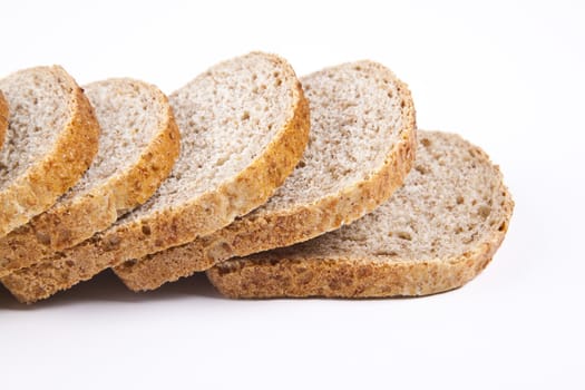 The cut loaf of bread with reflaction isolated on white