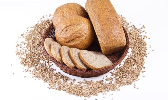 Assortment of baked bread with wheat isolated