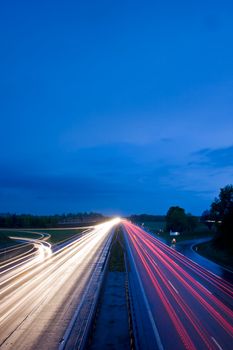 blurs of cars moving on a freeway