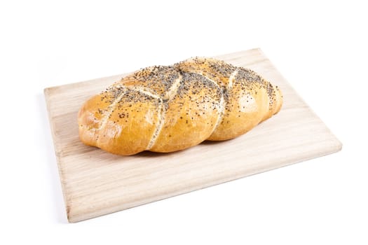 The fresh buns isolated on wooden plate