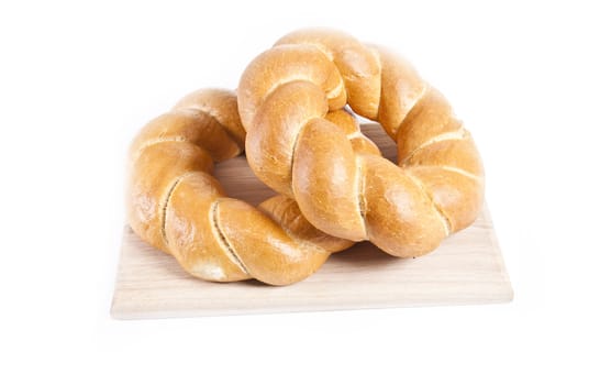 buns isolated on wooden plate