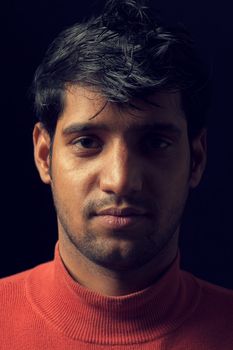 Grains & textures are added in the portrait of Indian man over dark background