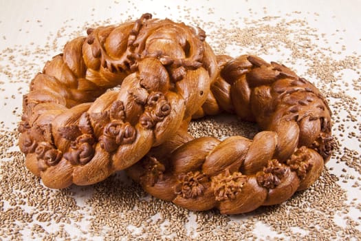 two breads with grain background