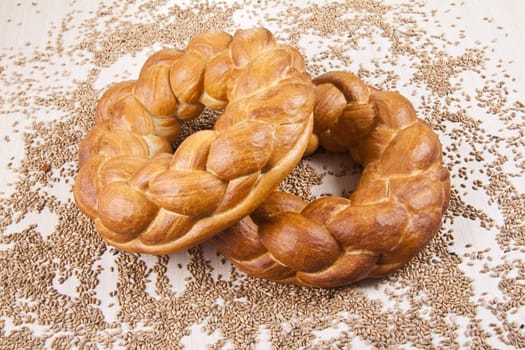 two breads with grain background
