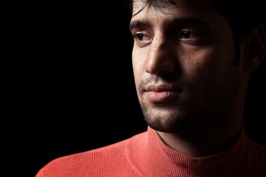 Grains & textures are added in the portrait of Indian man over dark background