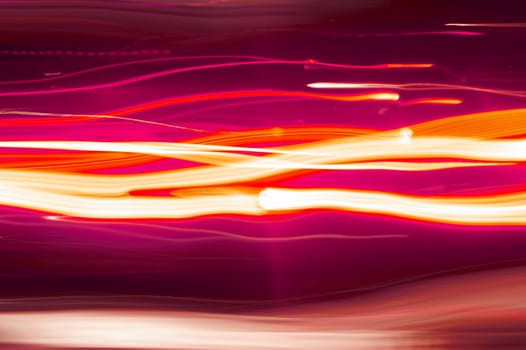 Moving textural, red lights on black background