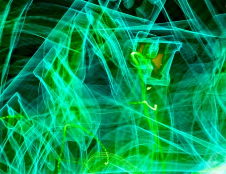 Green light painted streak on a black background